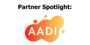 AADI logo. Text reads "Partner Spotlight"