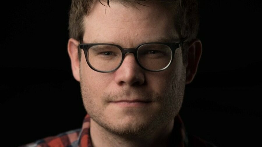 Peter Forbes headshot wearing glasses