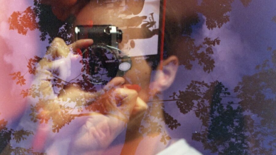 RJ LaRussa abstract headshot holding up a camera in front of their face
