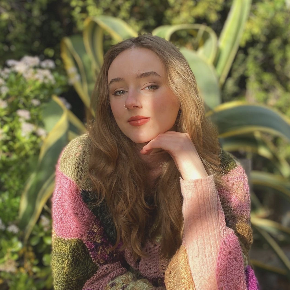 Sadie Fearon headshot in front of plants