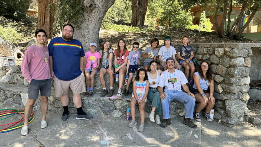 Ben Bond smiles with campers at Pilgrim Pines Summer Camp in Southern California.