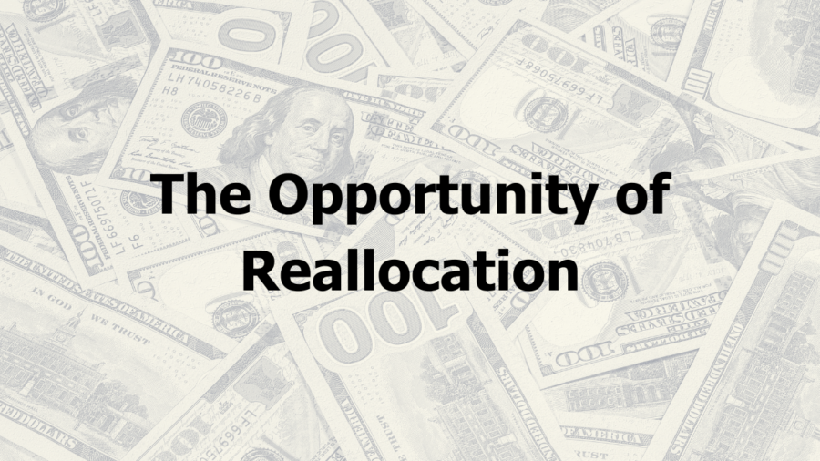 Text: The Opportunity of Reallocation. Background image has a pile of hundred dollar bills