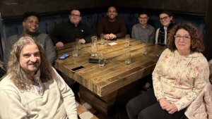 Ben Spangenberg with RespectAbility staff members around a table at a restaurant in Arlington