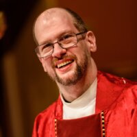 Rev. Padraic "Paddy" Collins-Bohrer smiling headshot