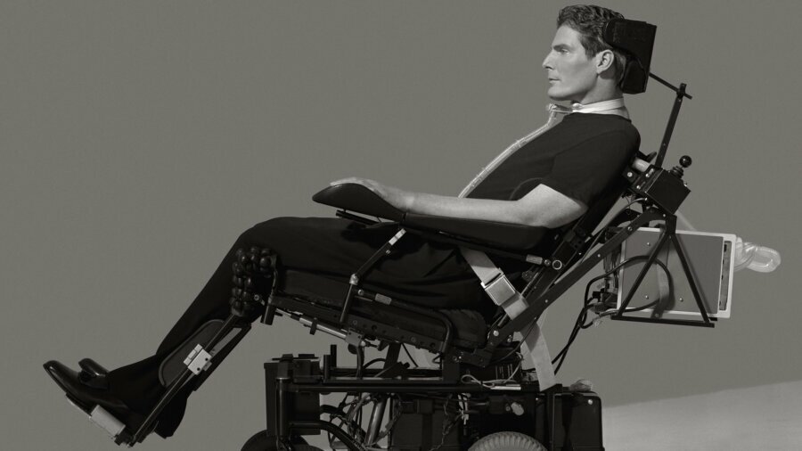 Christopher Reeve reclining in his wheelchair in a still from Super/Man