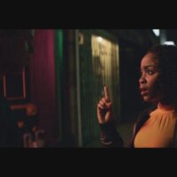 still from CODA with two characters speaking in sign language