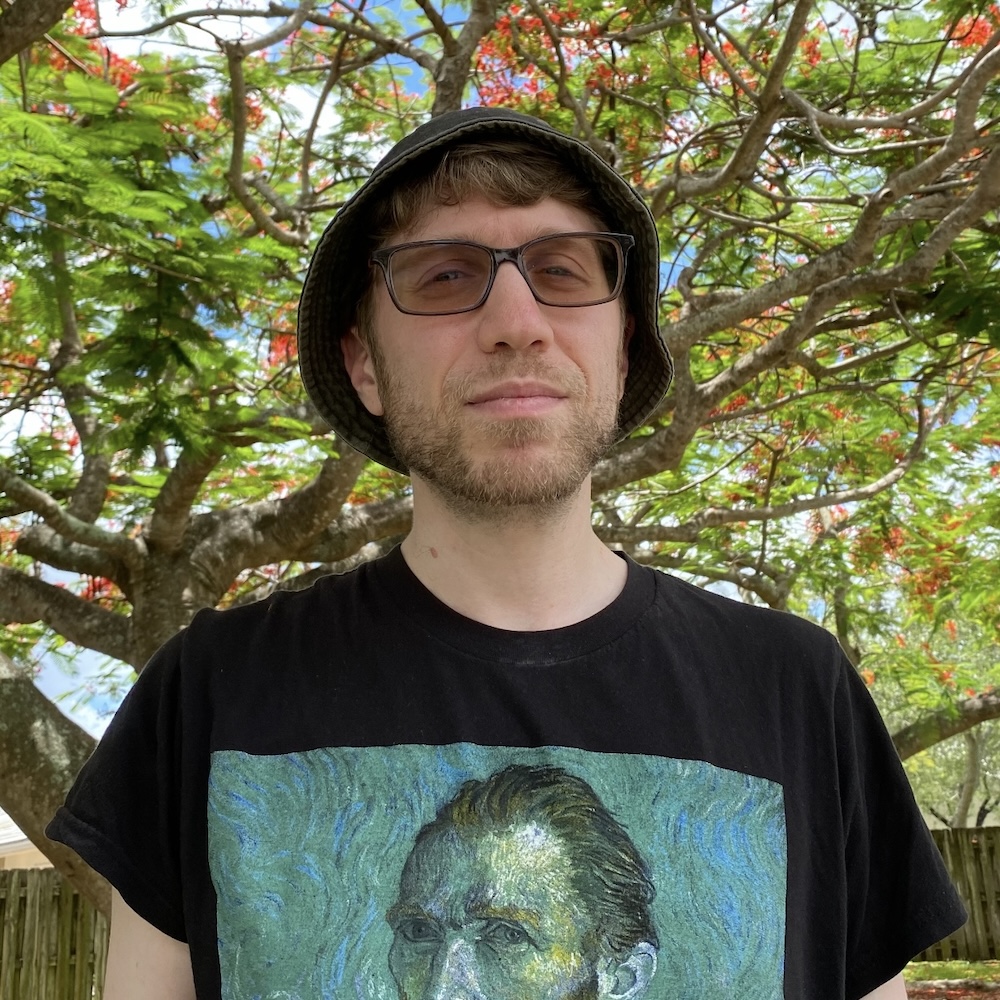 Ben Friedman headshot in front of trees