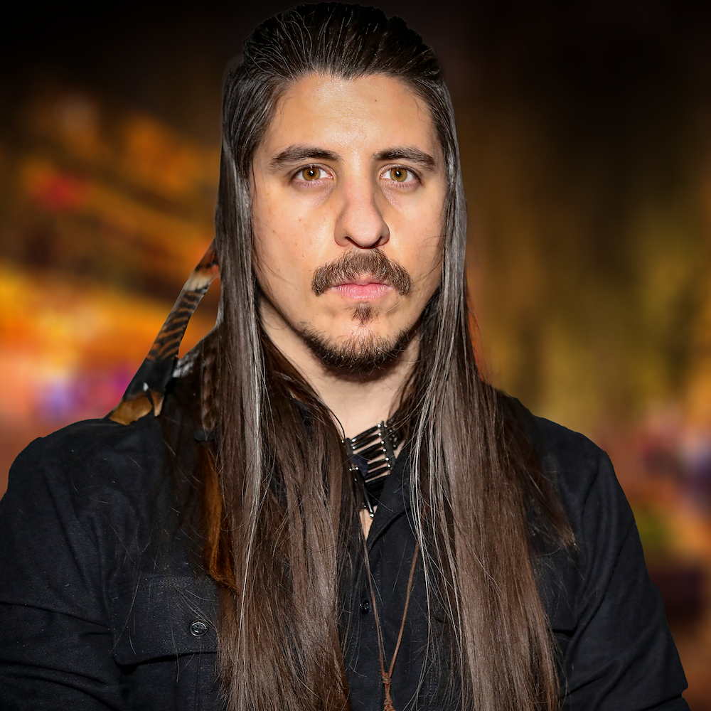 Derek Quick headshot wearing a denim jacket