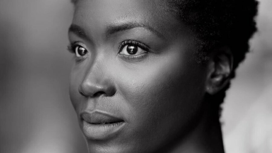 Faith Alabi black and white smiling headshot