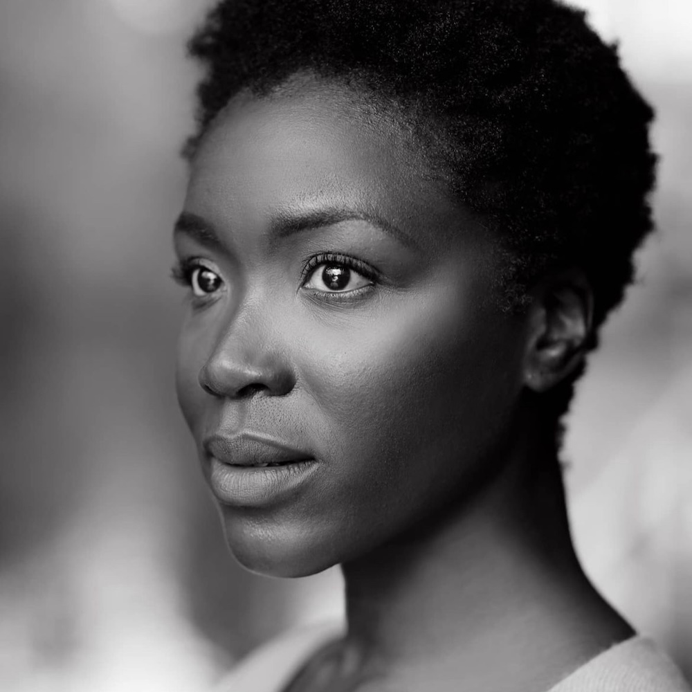 Faith Alabi black and white smiling headshot