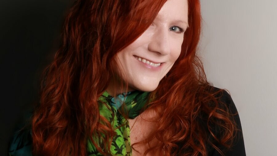 Kimberly Spire-Oh headshot smiling