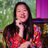 Maddy Ullman smiling headshot wearing a floral shirt