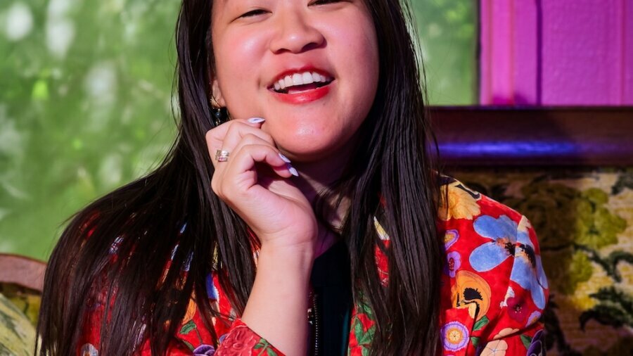 Maddy Ullman smiling headshot wearing a floral shirt