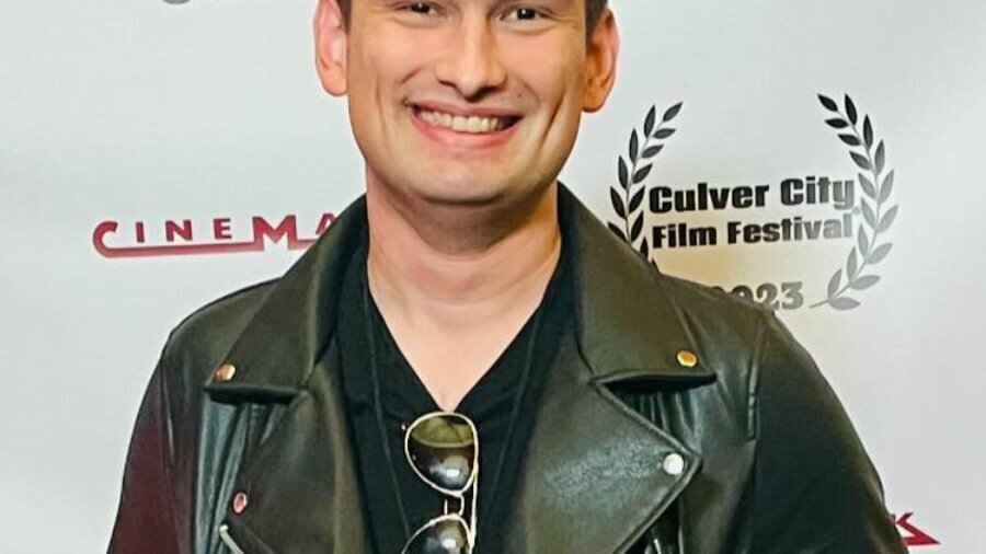 Robert Burns smiling headshot on the red carpet at the Culver City Film Festival