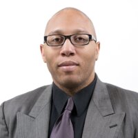 Stephan Collins-Stepney headshot wearing a suit and tie