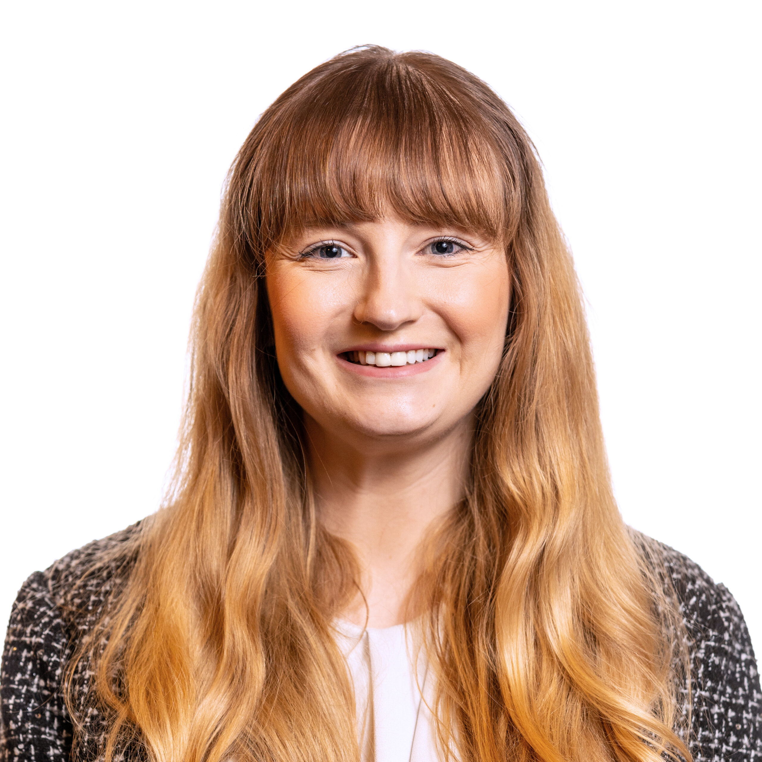 Julie Schurman smiling headshot wearing a black sweater and a white shirt