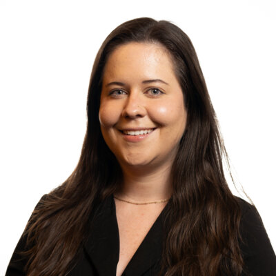 Lesley Hennen smiling headshot wearing a black blazer