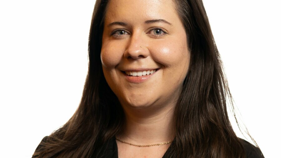 Lesley Hennen smiling headshot wearing a black blazer