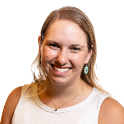 Rebecca Langbein smiling headshot wearing a white sleeveless top