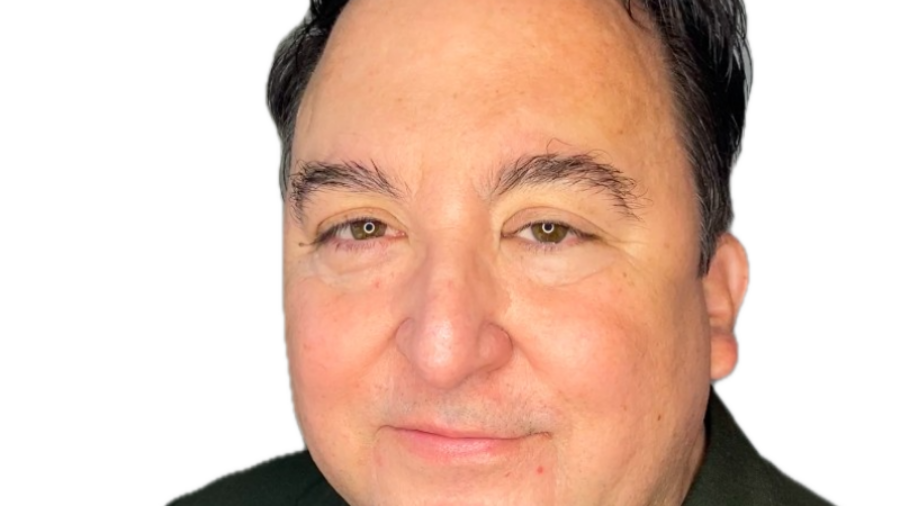 Darren Bates smiling headshot wearing a grey blazer