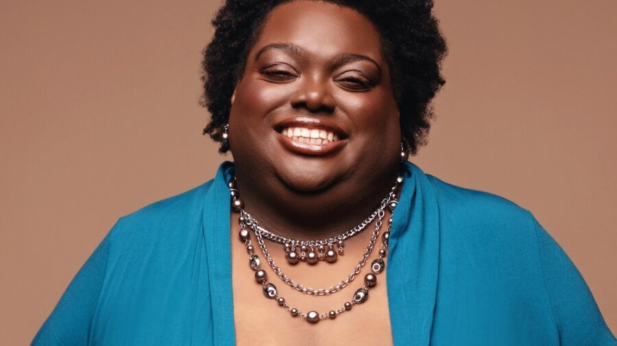 Allison Hampton smiling headshot wearing a blue blazer