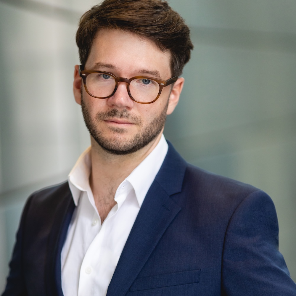 James Caverly headshot wearing a blue blazer