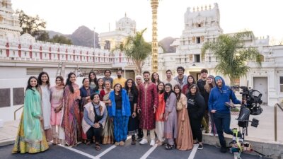 the cast and crew of Sūnna smiling together on set